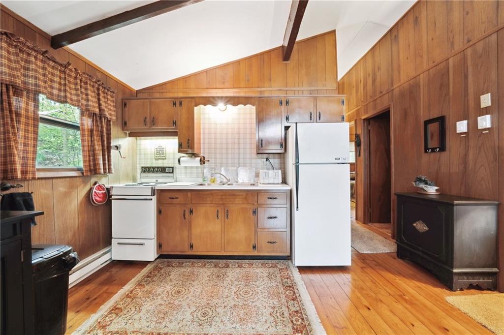 510 Forest Road Acme, PA 15610 - Photo 10 of 30 a kitchen with refrigerator and cabinets