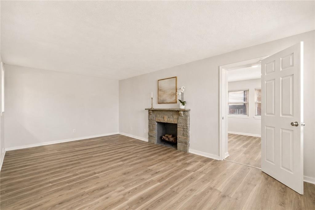 973 Agnew Road Pittsburgh, PA 15227 - Photo 8 of 46 The warm and welcoming stone fireplace is the focal point of the room