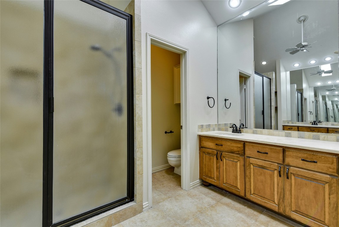 3509 Fawn Trail Austin, TX 78746 - Photo 17 of 30 a spacious bathroom with a double vanity sink a toilet and a shower