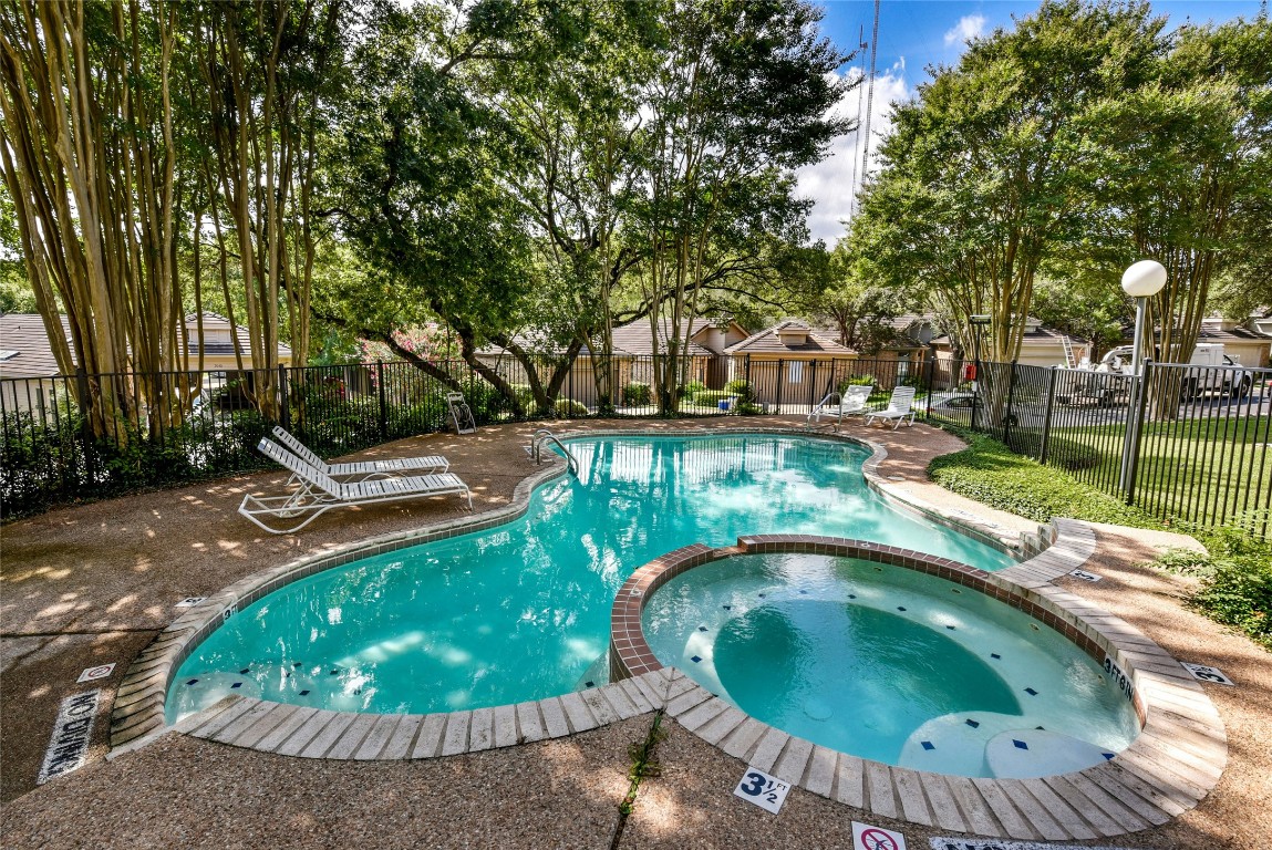 3509 Fawn Trail Austin, TX 78746 - Photo 26 of 30 a view of a swimming pool with a patio and plants