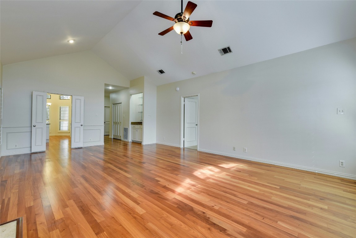3509 Fawn Trail Austin, TX 78746 - Photo 9 of 30 a view of a room with wooden floor and a ceiling fan