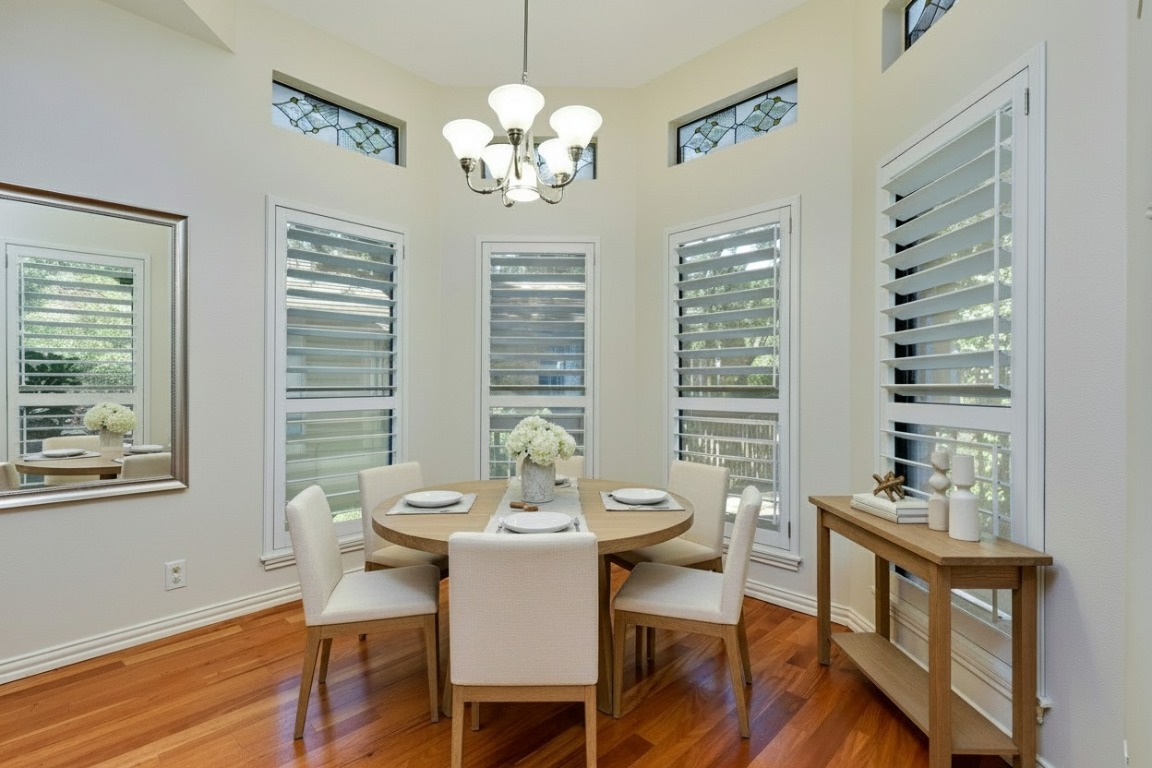 3509 Fawn Trail Austin, TX 78746 - Photo 10 of 30 a view of a dining room with furniture window and wooden floor