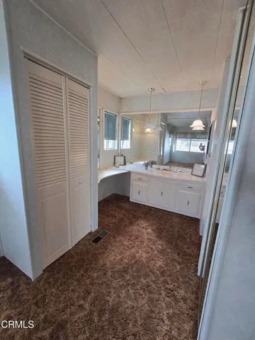 a bathroom with a sink and mirror