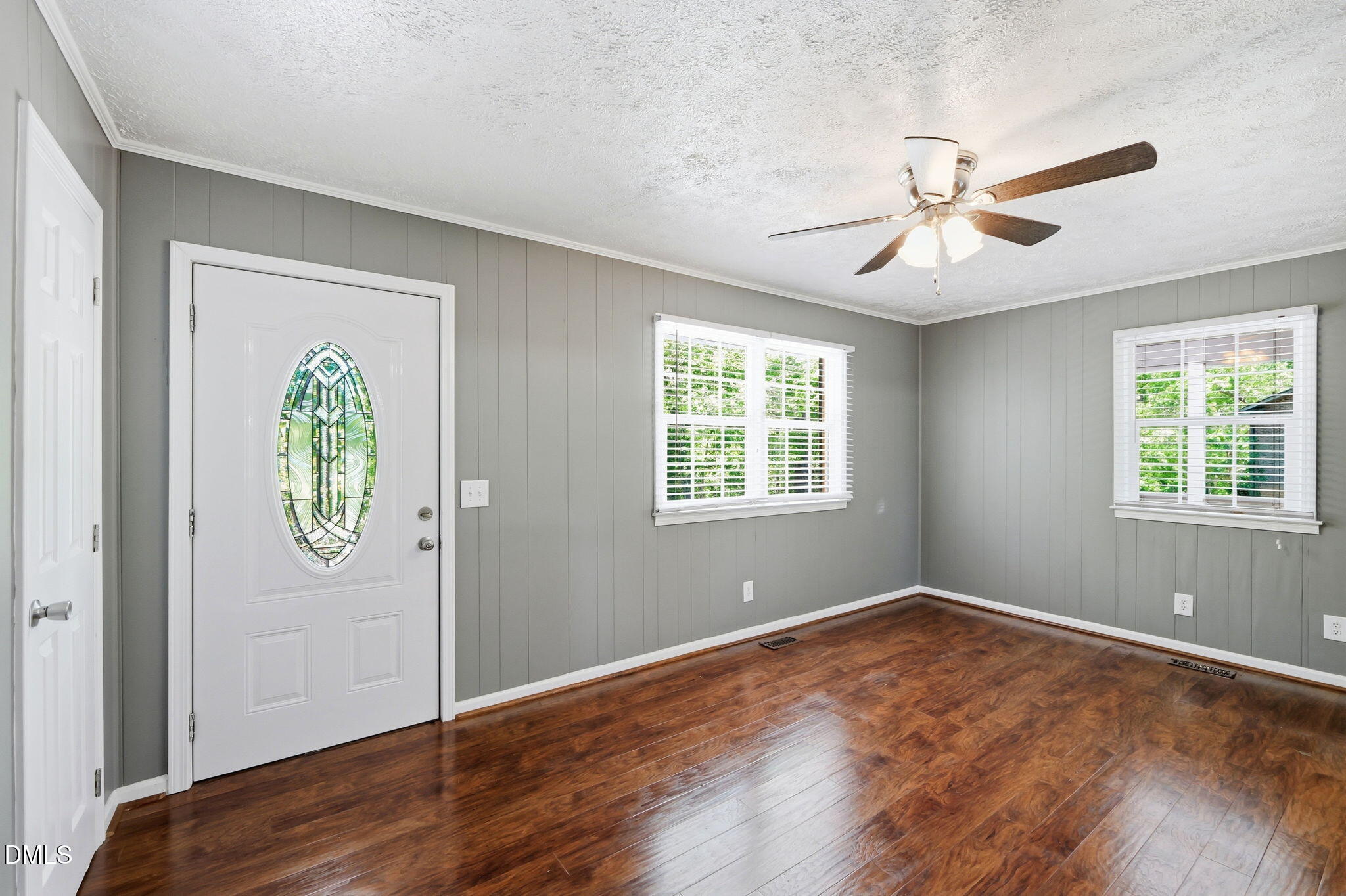 265 Shady Hill Circle Roxboro, NC 27573 - Photo 3 of 18 a view of an empty room with window and wooden floor