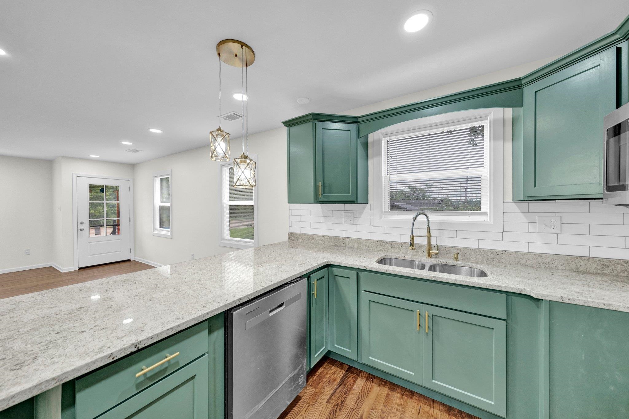 6681 Raleigh Millington Road Millington, TN 38053 - Photo 11 of 28 Kitchen featuring stainless steel dishwasher, green cabinetry, decorative backsplash, and recessed lighting