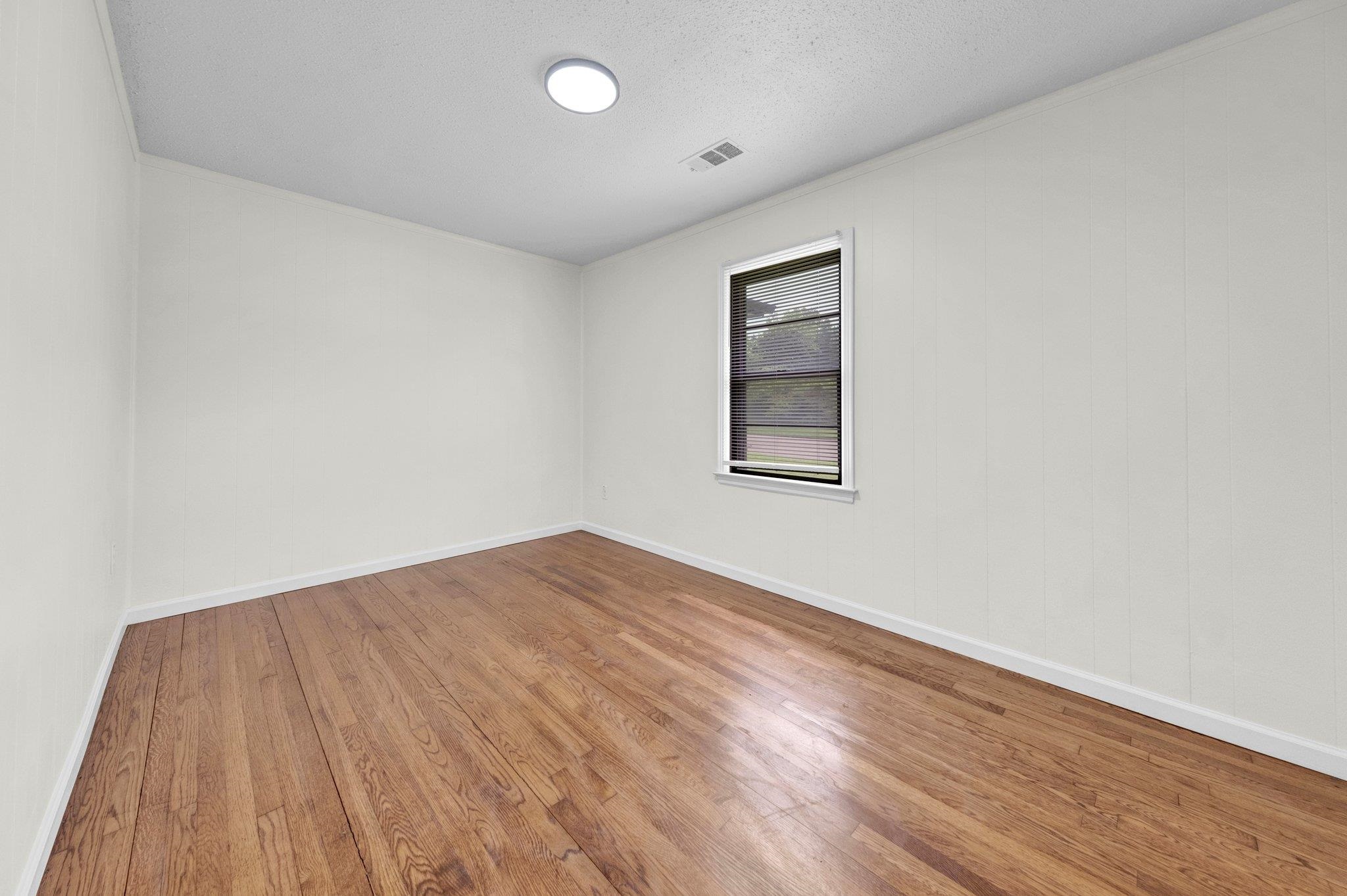 6681 Raleigh Millington Road Millington, TN 38053 - Photo 18 of 28 Unfurnished room with wood finished floors and crown molding