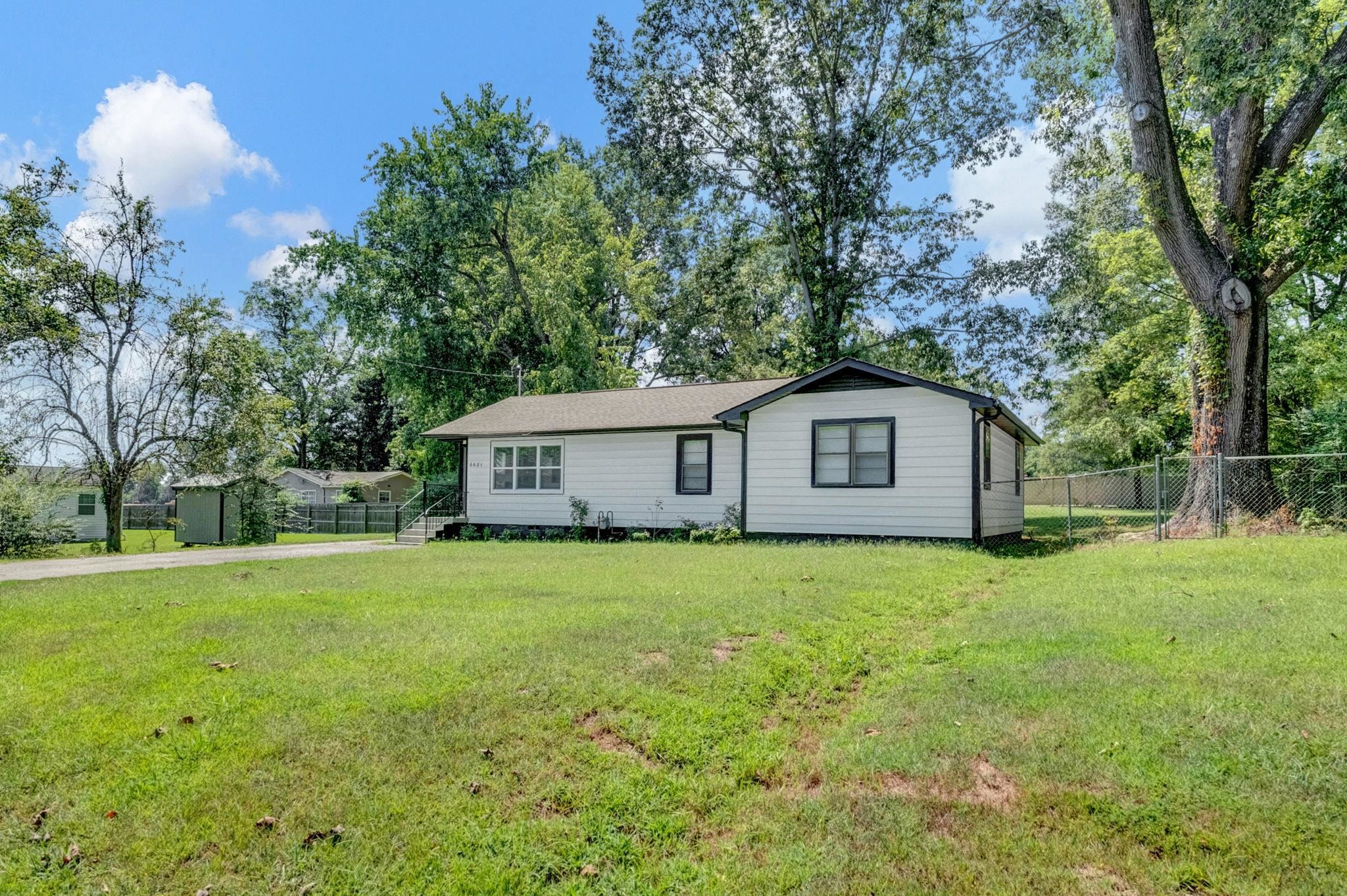 6681 Raleigh Millington Road Millington, TN 38053 - Photo 2 of 28 View of front of house featuring view of wooded area