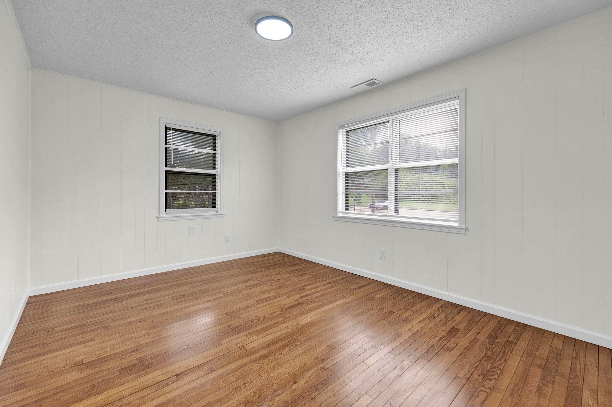 6681 Raleigh Millington Road Millington, TN 38053 - Photo 25 of 28 Unfurnished room with hardwood / wood-style flooring and a textured ceiling