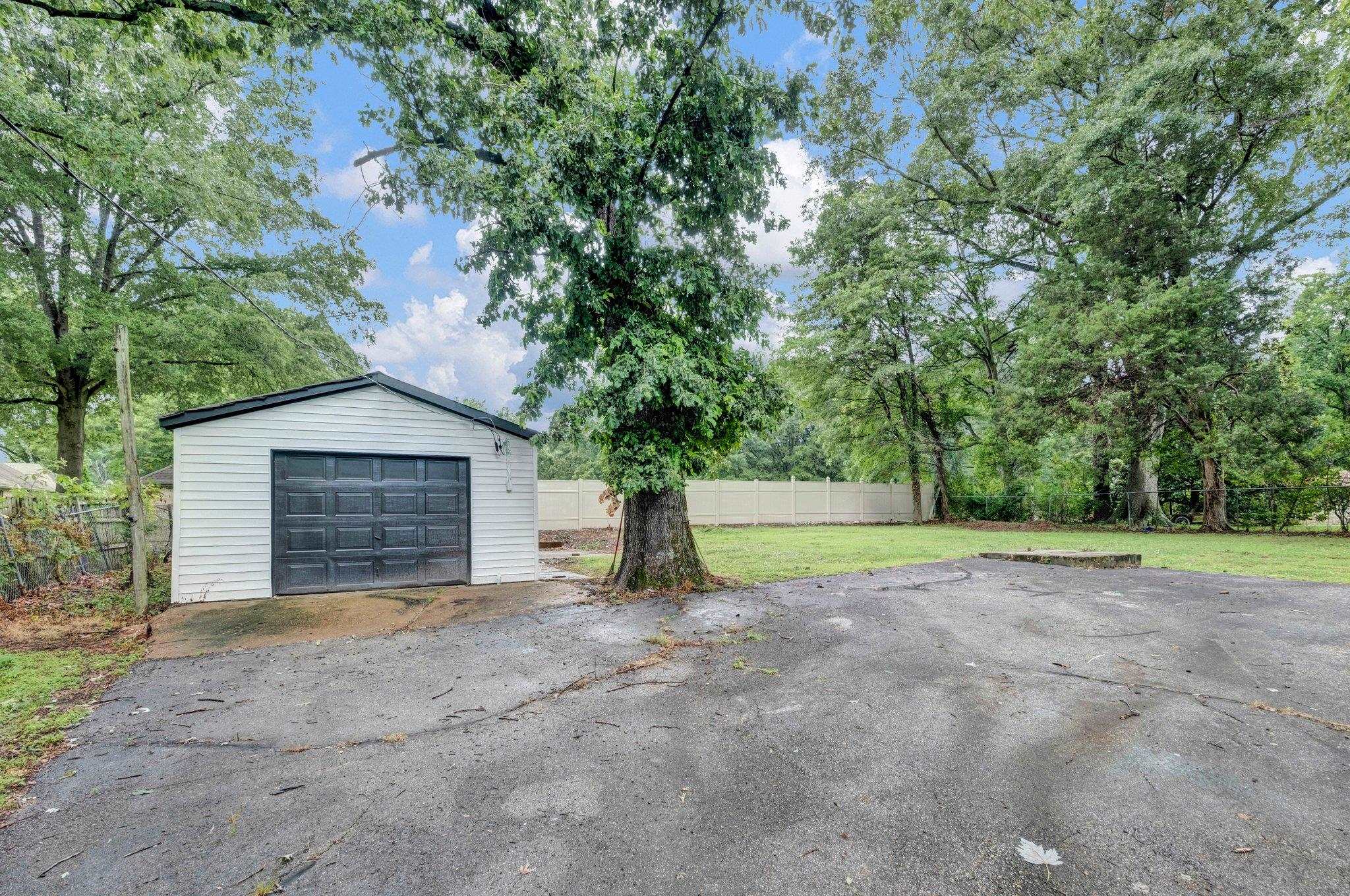 6681 Raleigh Millington Road Millington, TN 38053 - Photo 26 of 28 Detached garage featuring asphalt driveway