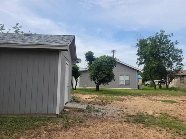 a house with trees in the background