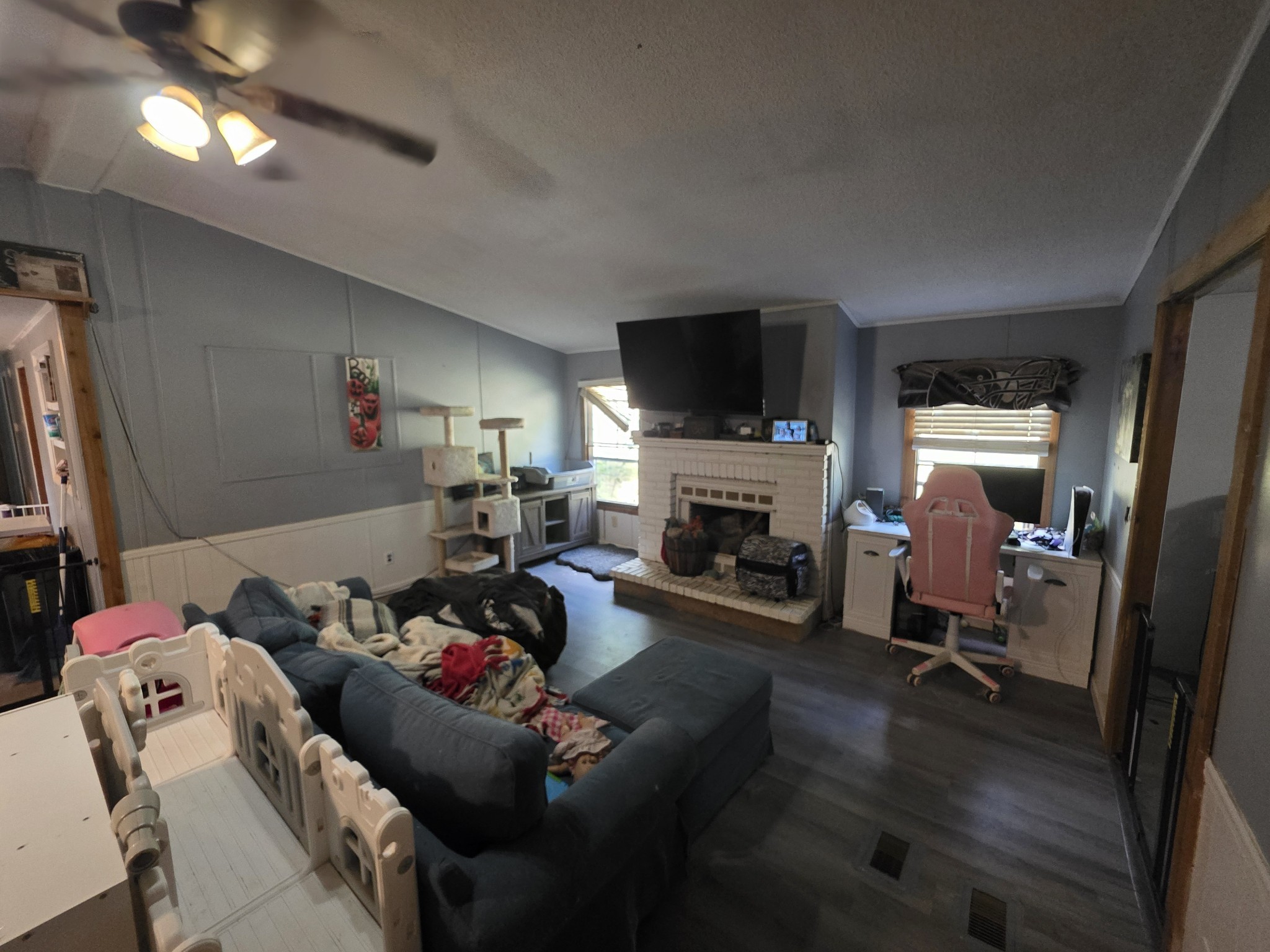 225 Opossum Hollow Road Watertown, TN 37184 - Photo 10 of 29 a living room with furniture fireplace and a flat screen tv