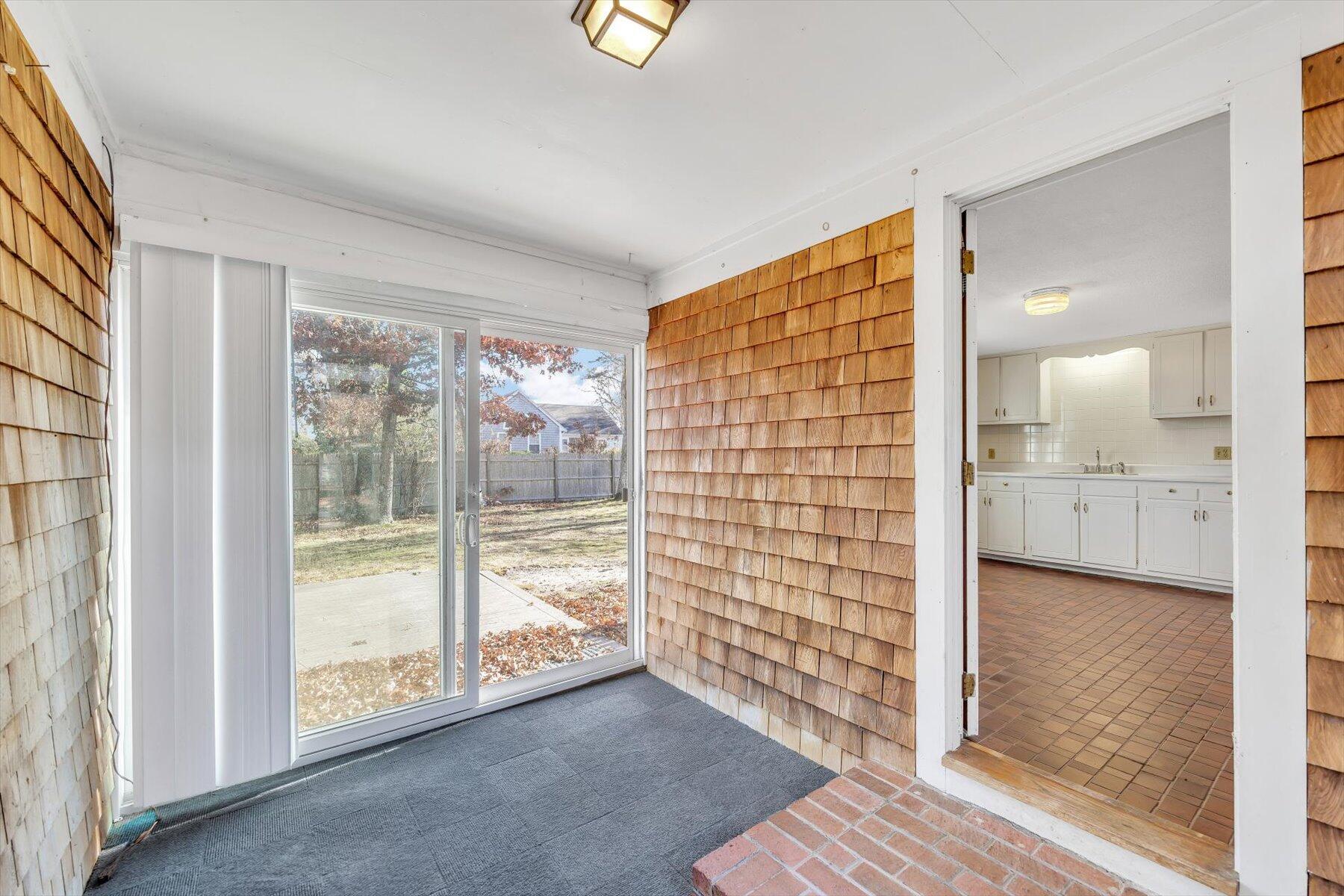 360 Airline Road South Dennis, MA 02660 - Photo 11 of 30 a view of empty room with wooden floor and fan