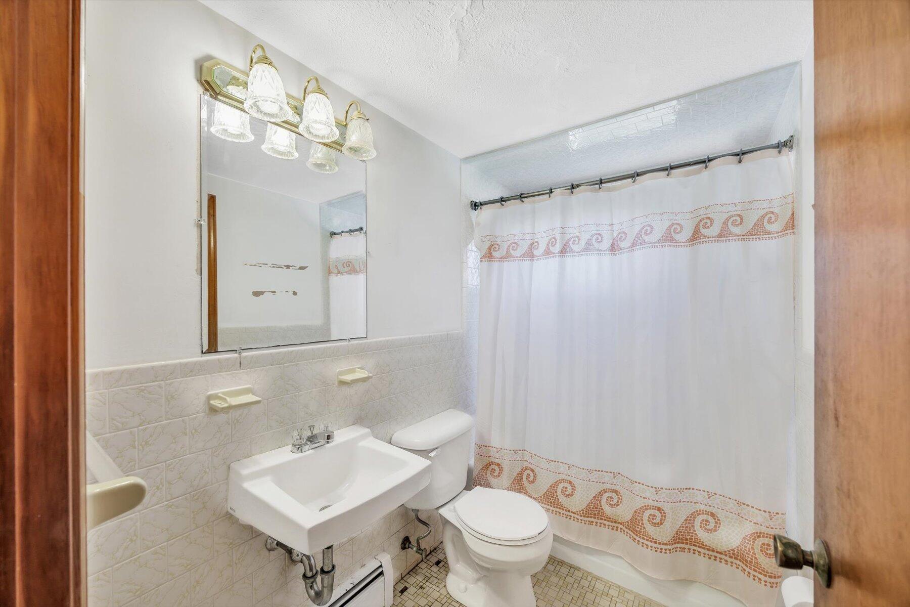 360 Airline Road South Dennis, MA 02660 - Photo 14 of 30 a bathroom with a sink toilet and shower
