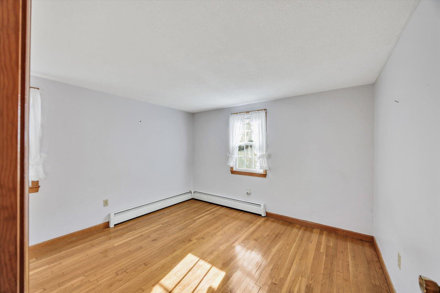 360 Airline Road South Dennis, MA 02660 - Photo 15 of 30 a view of a room with wooden floor and window