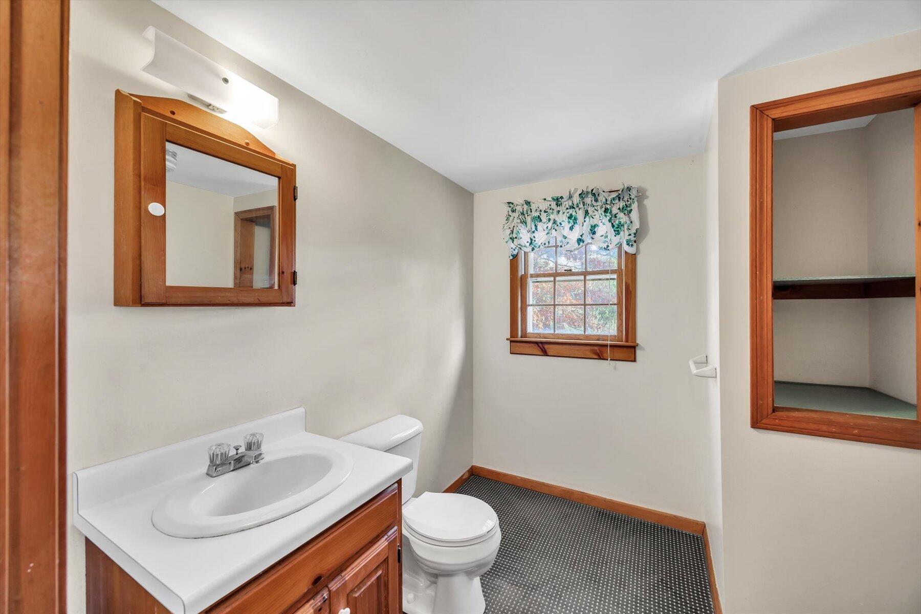 360 Airline Road South Dennis, MA 02660 - Photo 25 of 30 a bathroom with a sink toilet and a mirror