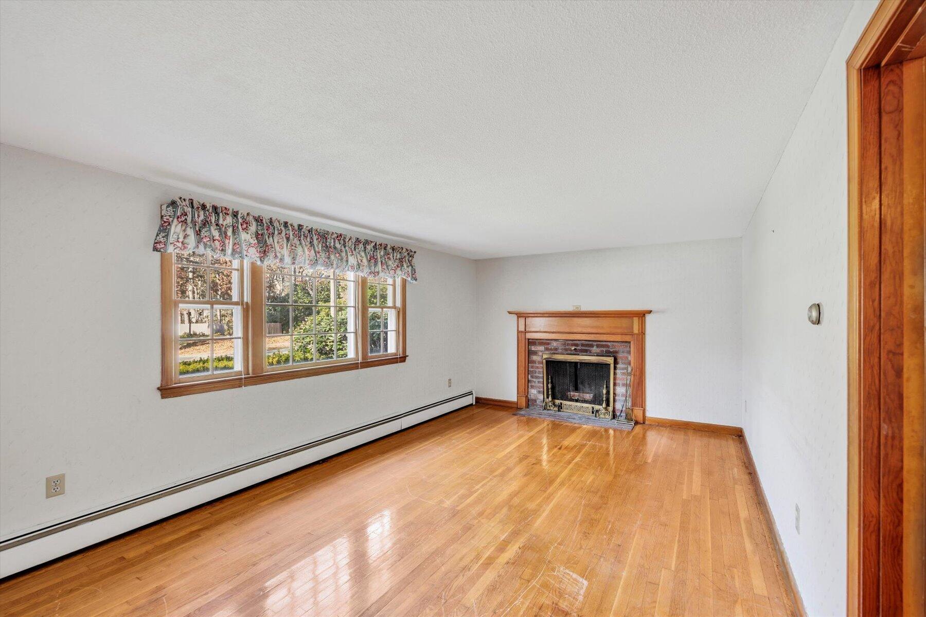 360 Airline Road South Dennis, MA 02660 - Photo 5 of 30 a view of an empty room with window and fire place
