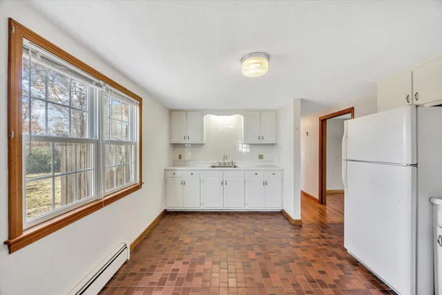 a kitchen with cabinets oven and a dishwasher