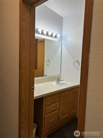 a bathroom with a sink and a mirror