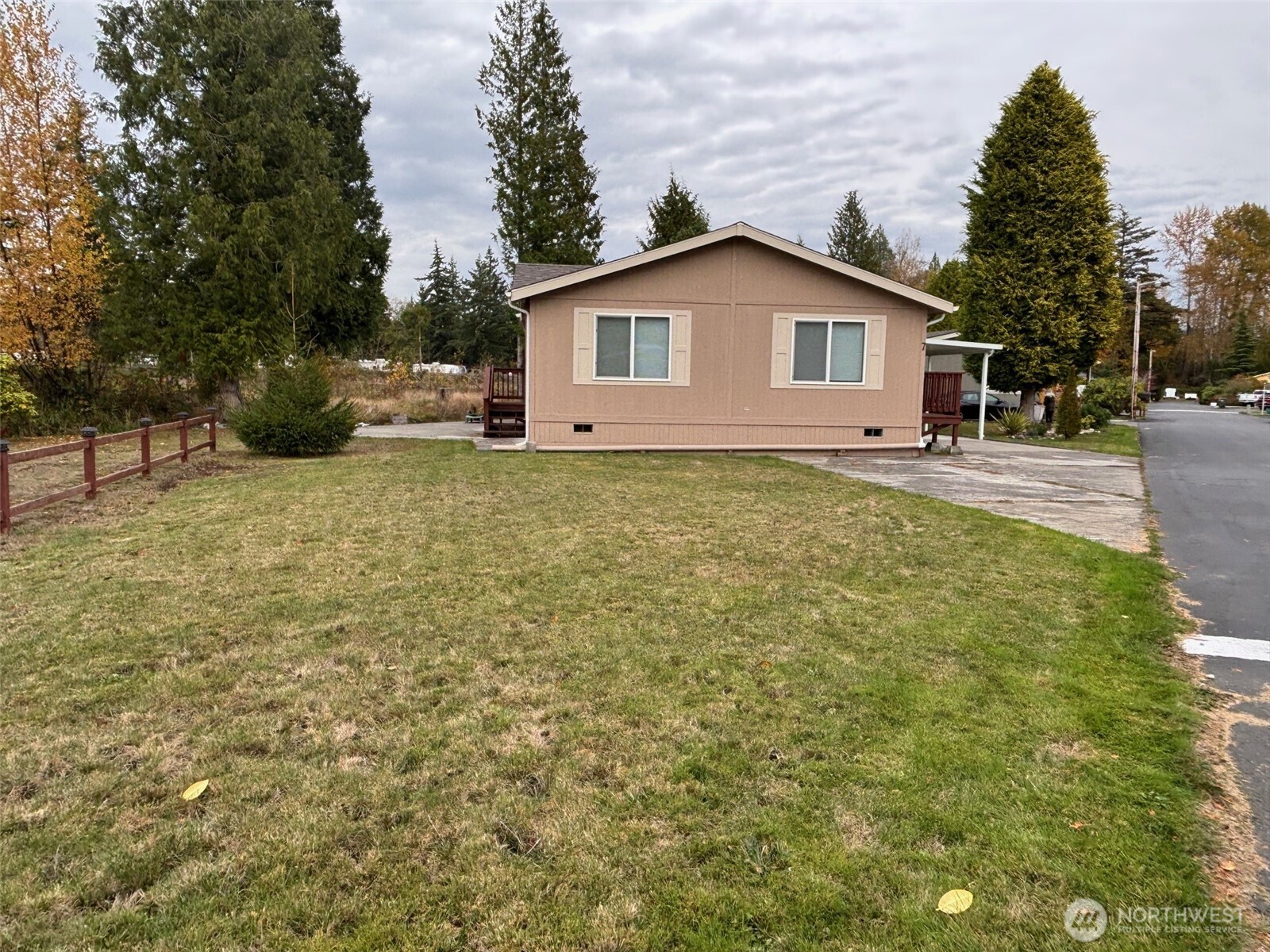 8370 Harborview Road, Unit 7 Blaine, WA 98230 - Photo 2 of 29 a view of a house with a yard