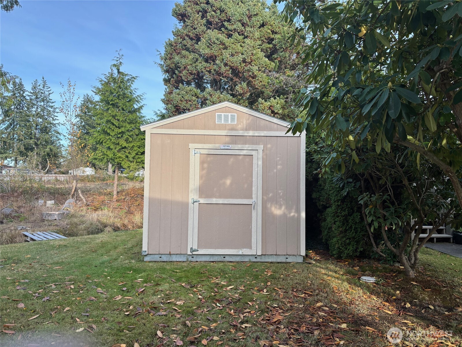 8370 Harborview Road, Unit 7 Blaine, WA 98230 - Photo 23 of 29 a front view of a house with garden