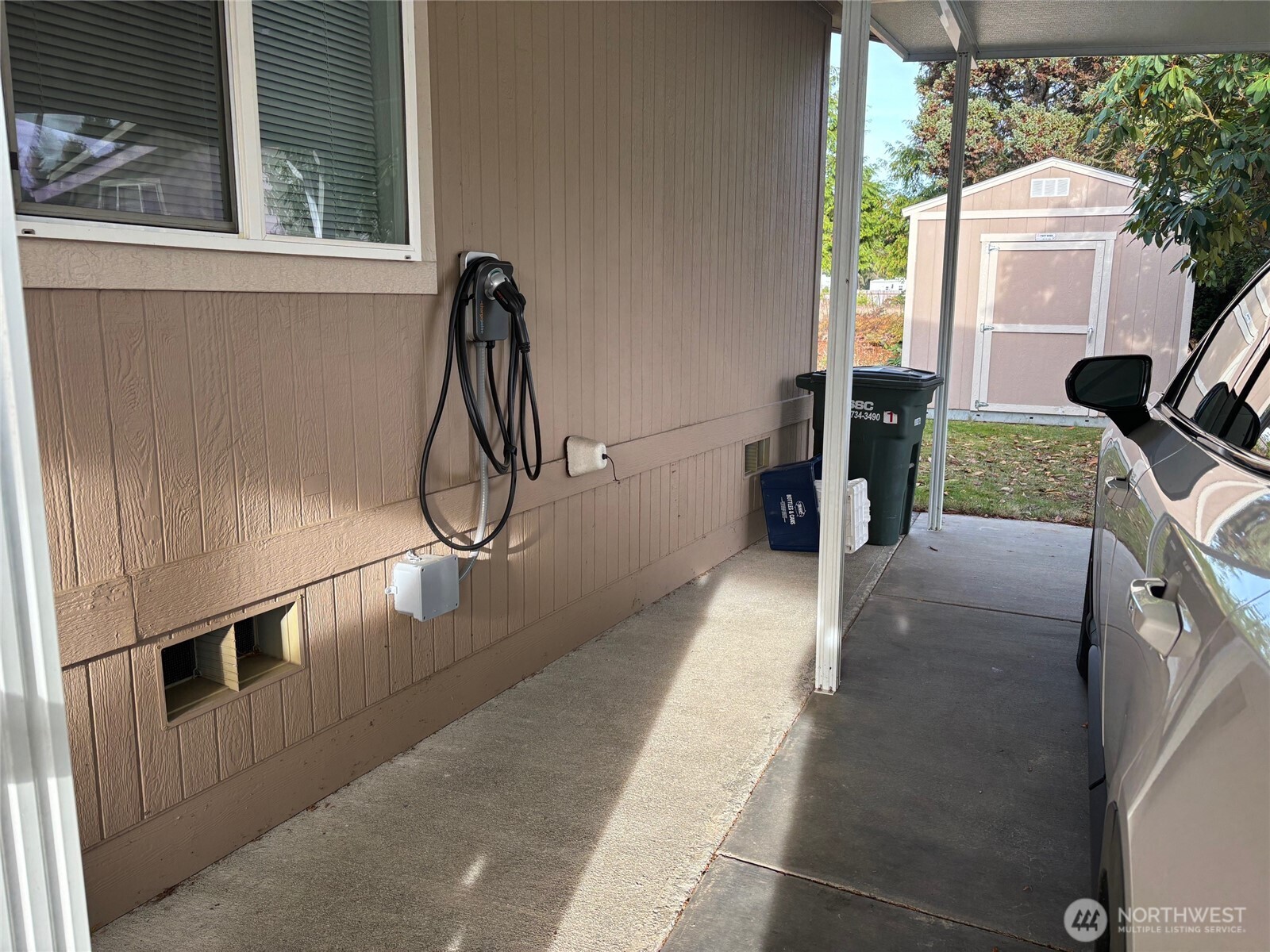 8370 Harborview Road, Unit 7 Blaine, WA 98230 - Photo 28 of 29 a hallway with a couch and a window