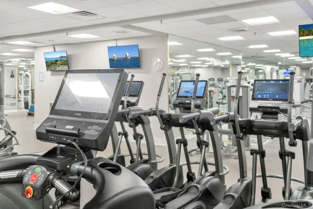 a view of a wooden house with a small yard and wooden fence