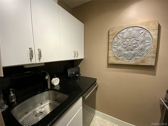 a kitchen with a sink and a stove