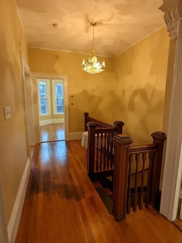 a view of a balcony with wooden floor