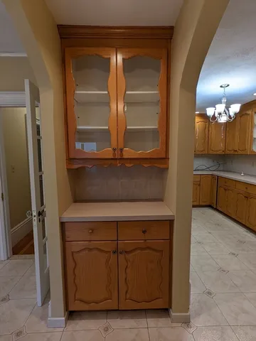 a kitchen with a sink and a refrigerator