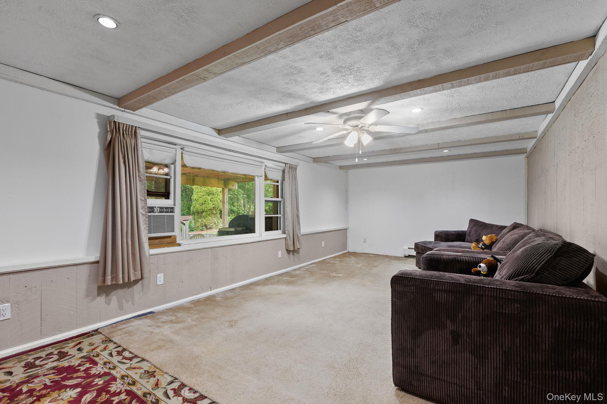 25 Harmony Road Brewster, NY 10509 - Photo 28 of 42 Spacious finished basement with view of the patio and backyard.