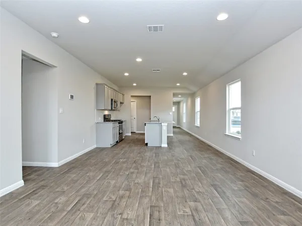 a view of kitchen with wooden floor