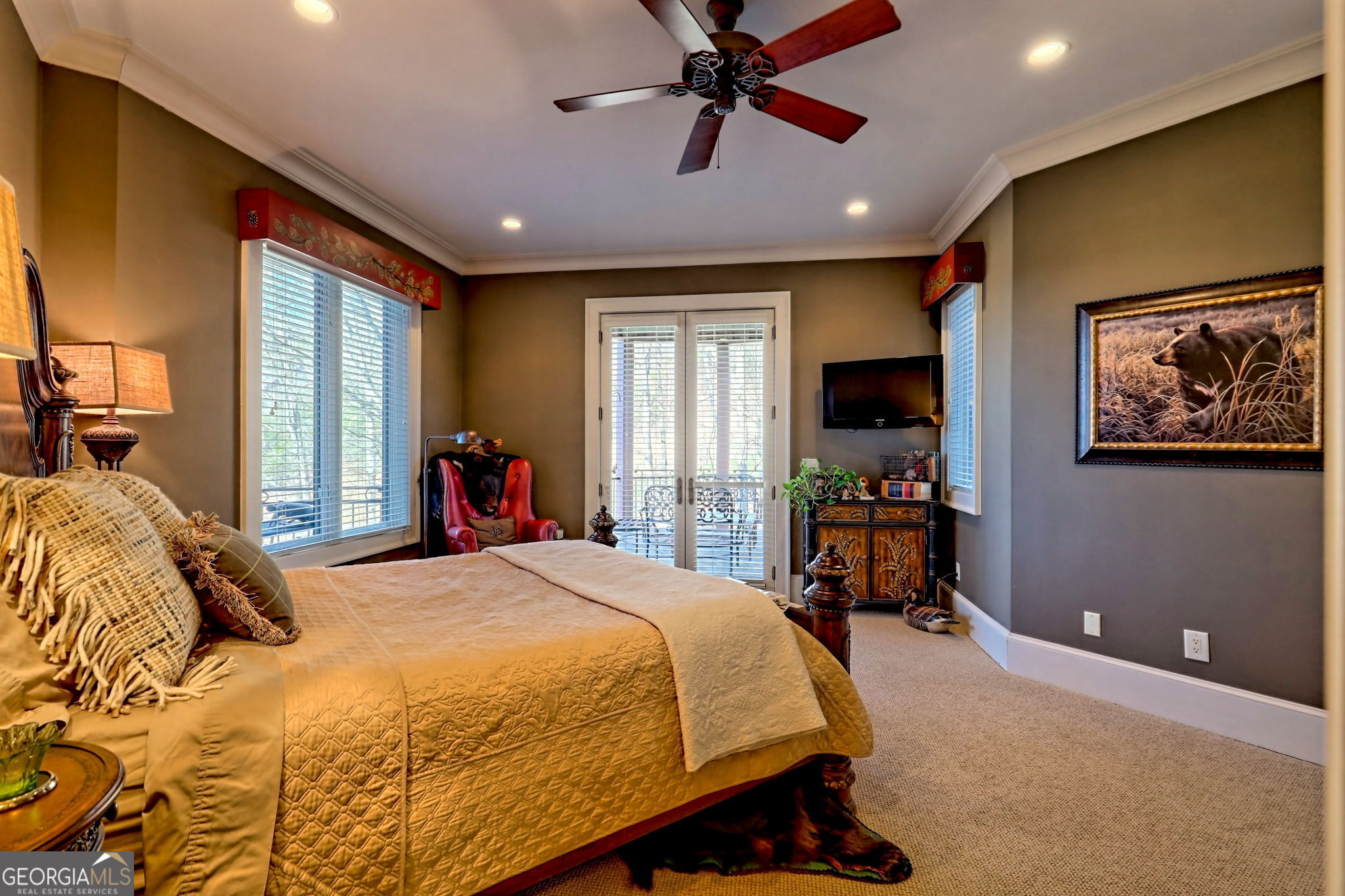 689 Waterfall Drive Clayton, GA 30525 - Photo 70 of 108 a bedroom with a large bed and a chandelier