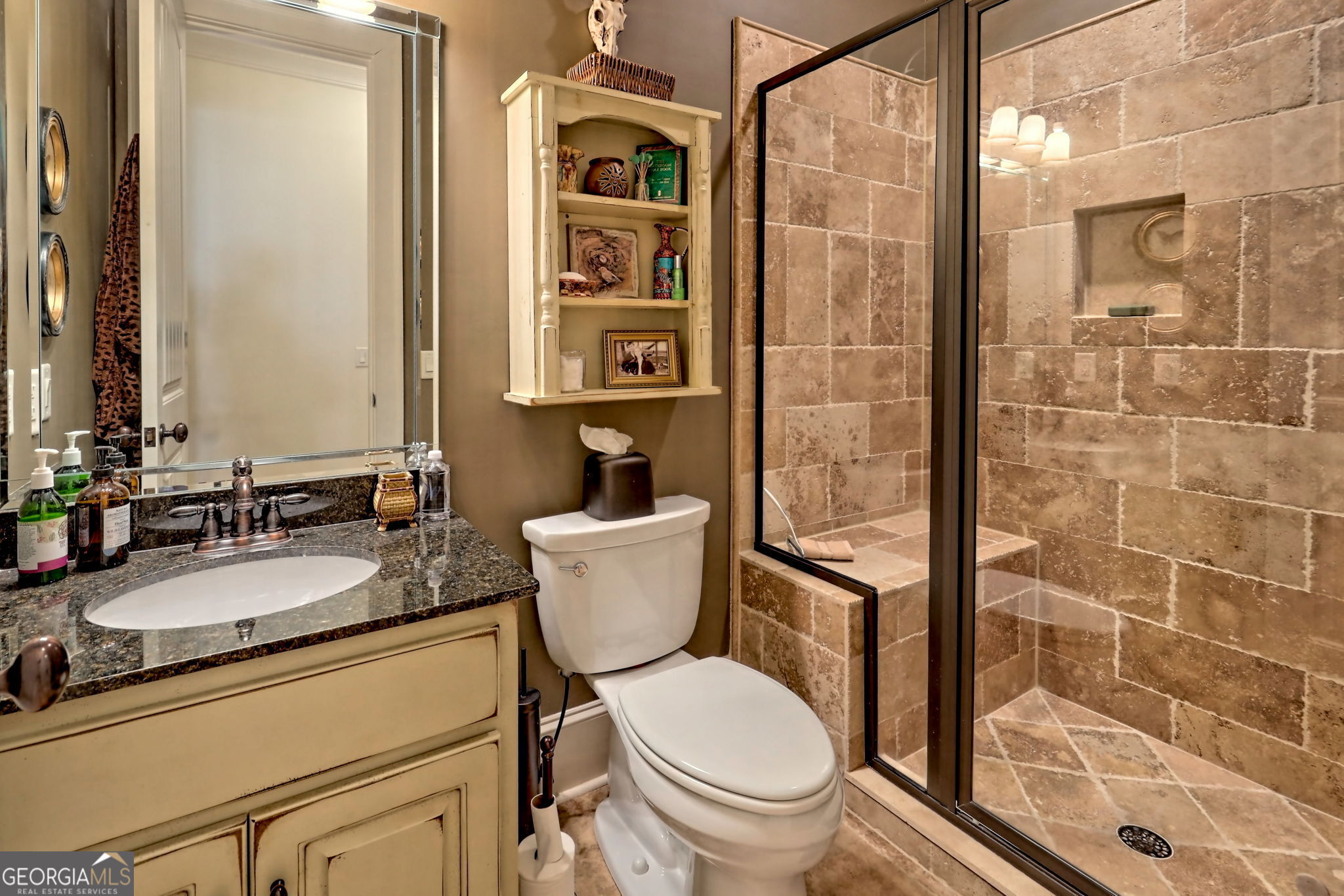 689 Waterfall Drive Clayton, GA 30525 - Photo 78 of 108 a bathroom with a granite countertop toilet sink and shower