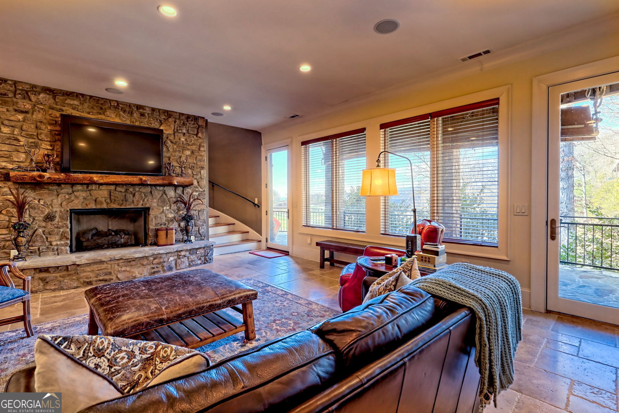 689 Waterfall Drive Clayton, GA 30525 - Photo 93 of 108 a living room with furniture a flat screen tv and a fireplace