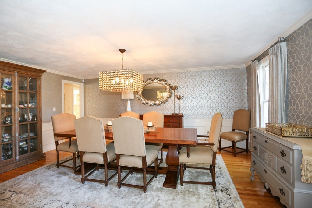 84 Fox Run Road Sudbury, MA 01776 - Photo 8 of 26 a dining room with furniture a chandelier and window