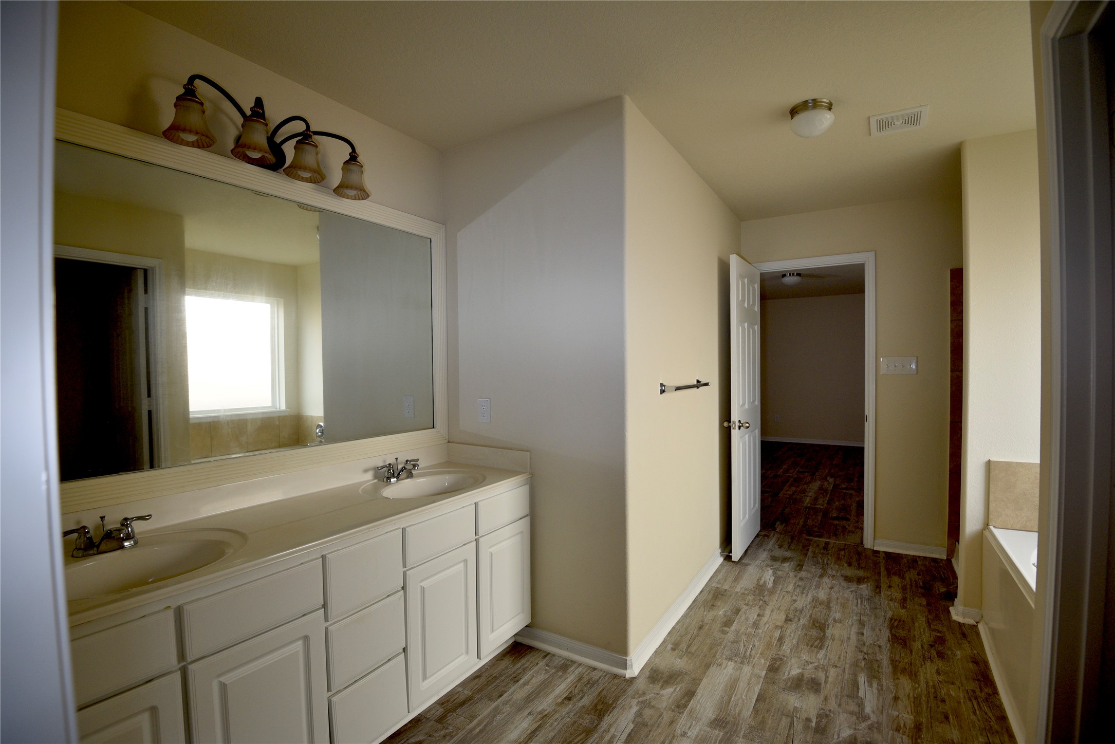 9997 Hyacinth Way Conroe, TX 77385 - Photo 20 of 45 a bathroom with a double vanity sink and a mirror