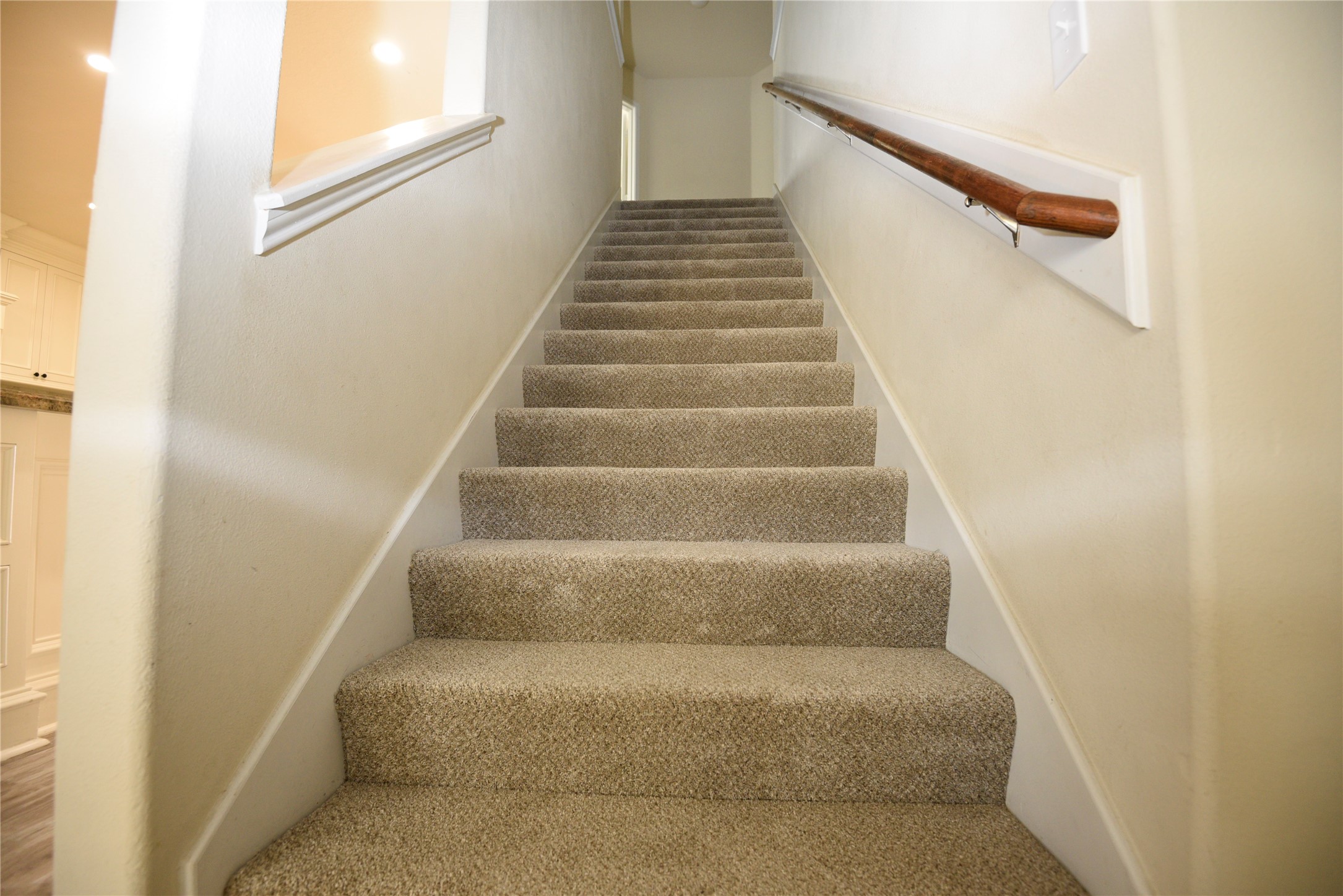 9997 Hyacinth Way Conroe, TX 77385 - Photo 21 of 45 a view of staircase with white walls and white door