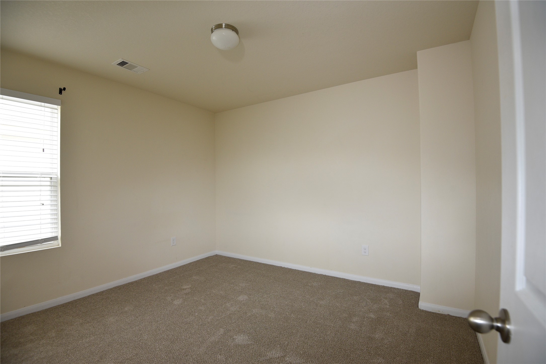 9997 Hyacinth Way Conroe, TX 77385 - Photo 27 of 45 an empty room with a window