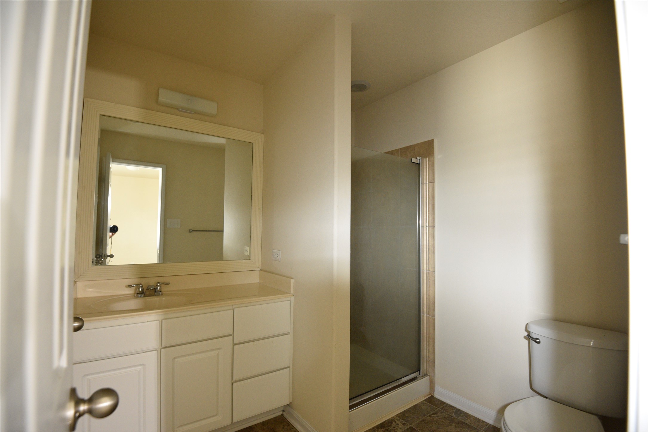 9997 Hyacinth Way Conroe, TX 77385 - Photo 29 of 45 a bathroom with a granite countertop sink mirror and toilet