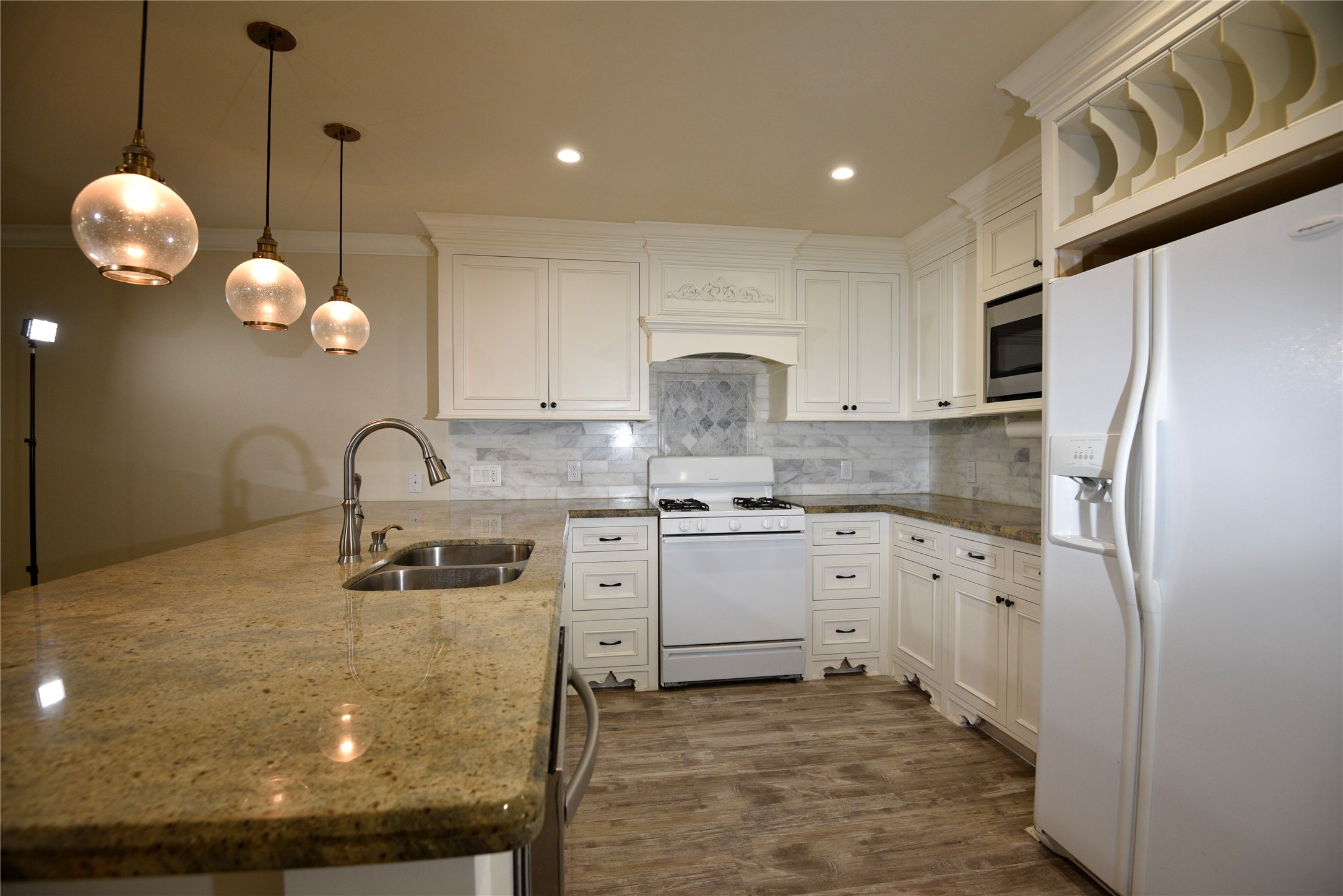9997 Hyacinth Way Conroe, TX 77385 - Photo 9 of 45 a kitchen with cabinets and window