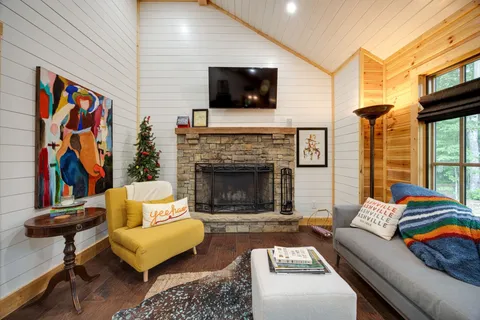 a living room with furniture and a fireplace