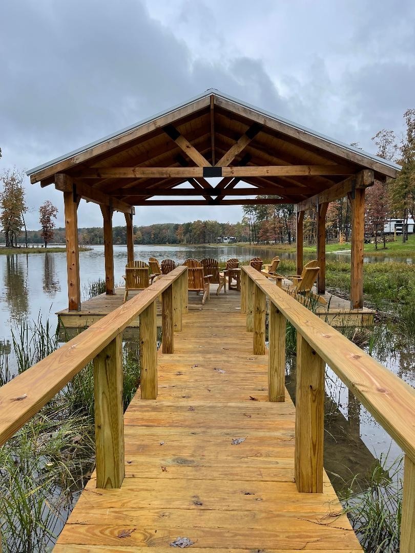 292 Waters Edge Way Tracy City, TN 37387 - Photo 15 of 17 a view of a balcony with wooden floor and lake view