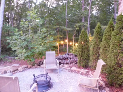 a view of a chair and tables in the patio