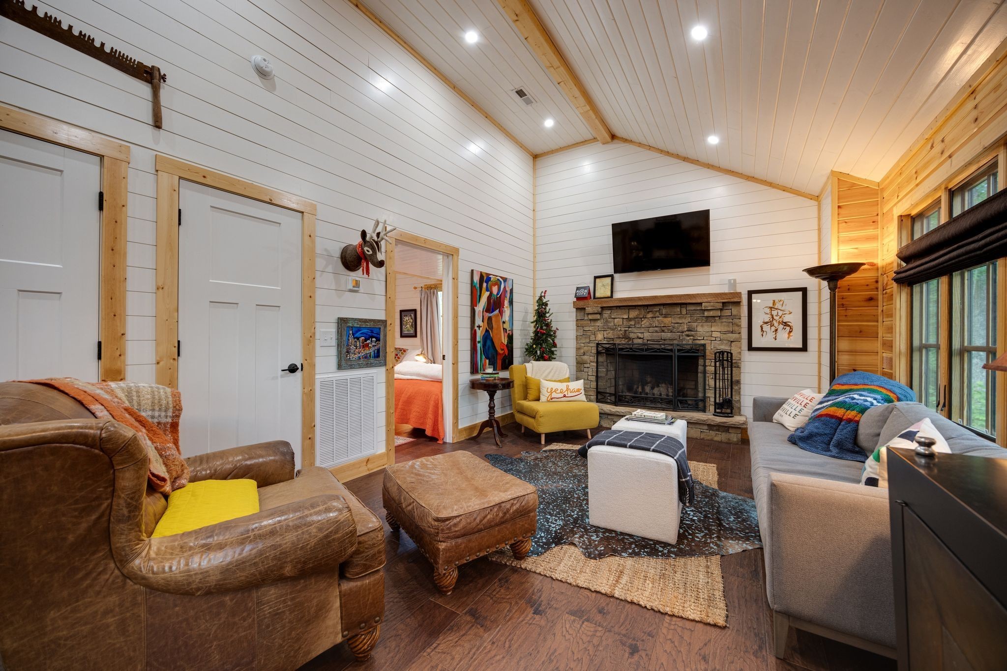 292 Waters Edge Way Tracy City, TN 37387 - Photo 5 of 17 a living room with furniture a flat screen tv and a fireplace