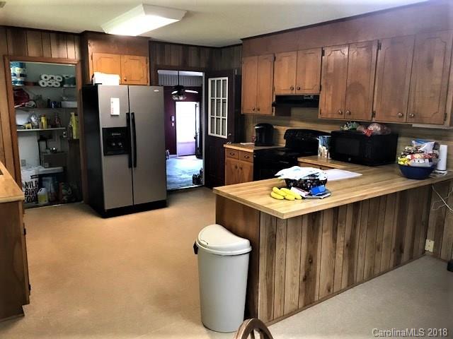 2426 New Cut Church Road Lancaster, SC 29720 - Photo 12 of 28 a kitchen that has a refrigerator and a stove