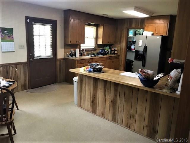 2426 New Cut Church Road Lancaster, SC 29720 - Photo 13 of 28 a kitchen with stainless steel appliances kitchen island granite countertop a refrigerator and a stove top oven