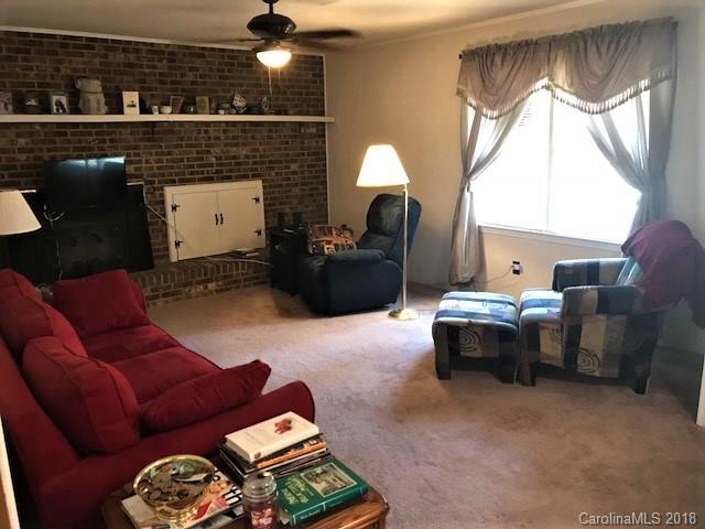 2426 New Cut Church Road Lancaster, SC 29720 - Photo 15 of 28 a living room with furniture and a fireplace