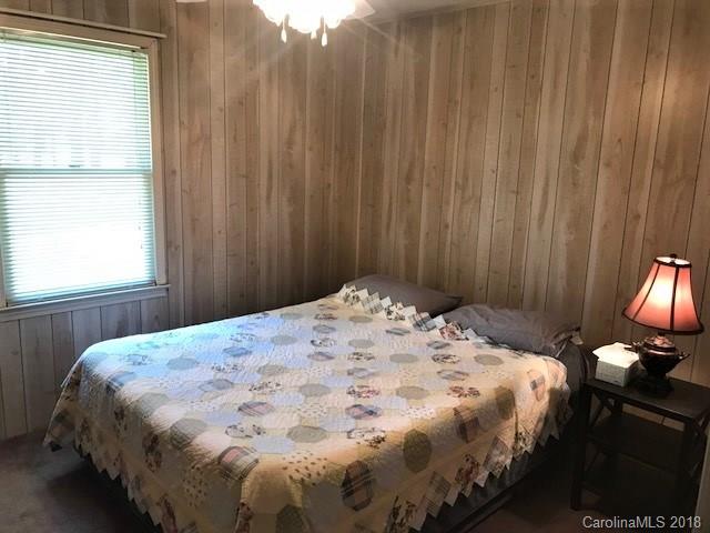 2426 New Cut Church Road Lancaster, SC 29720 - Photo 18 of 28 a bedroom with a bed and a chandelier