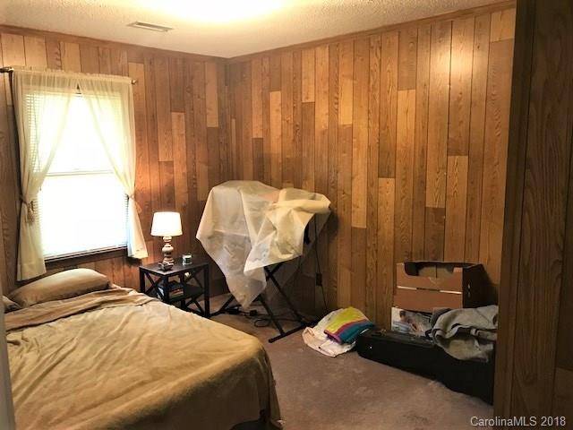 2426 New Cut Church Road Lancaster, SC 29720 - Photo 21 of 28 a bedroom with a bed and a chair