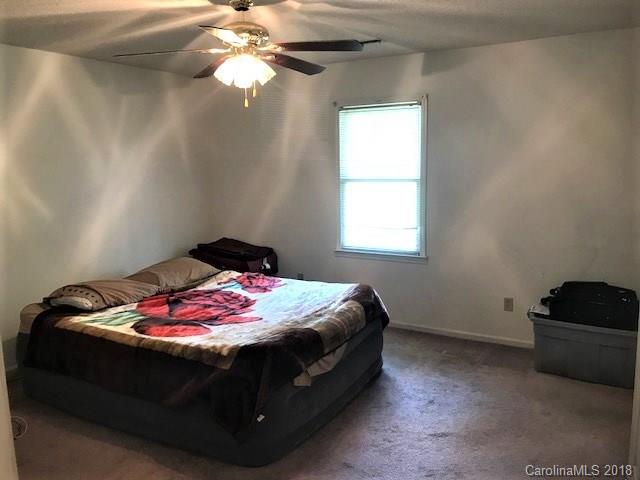 2426 New Cut Church Road Lancaster, SC 29720 - Photo 22 of 28 a bedroom with a bed and a chandelier fan